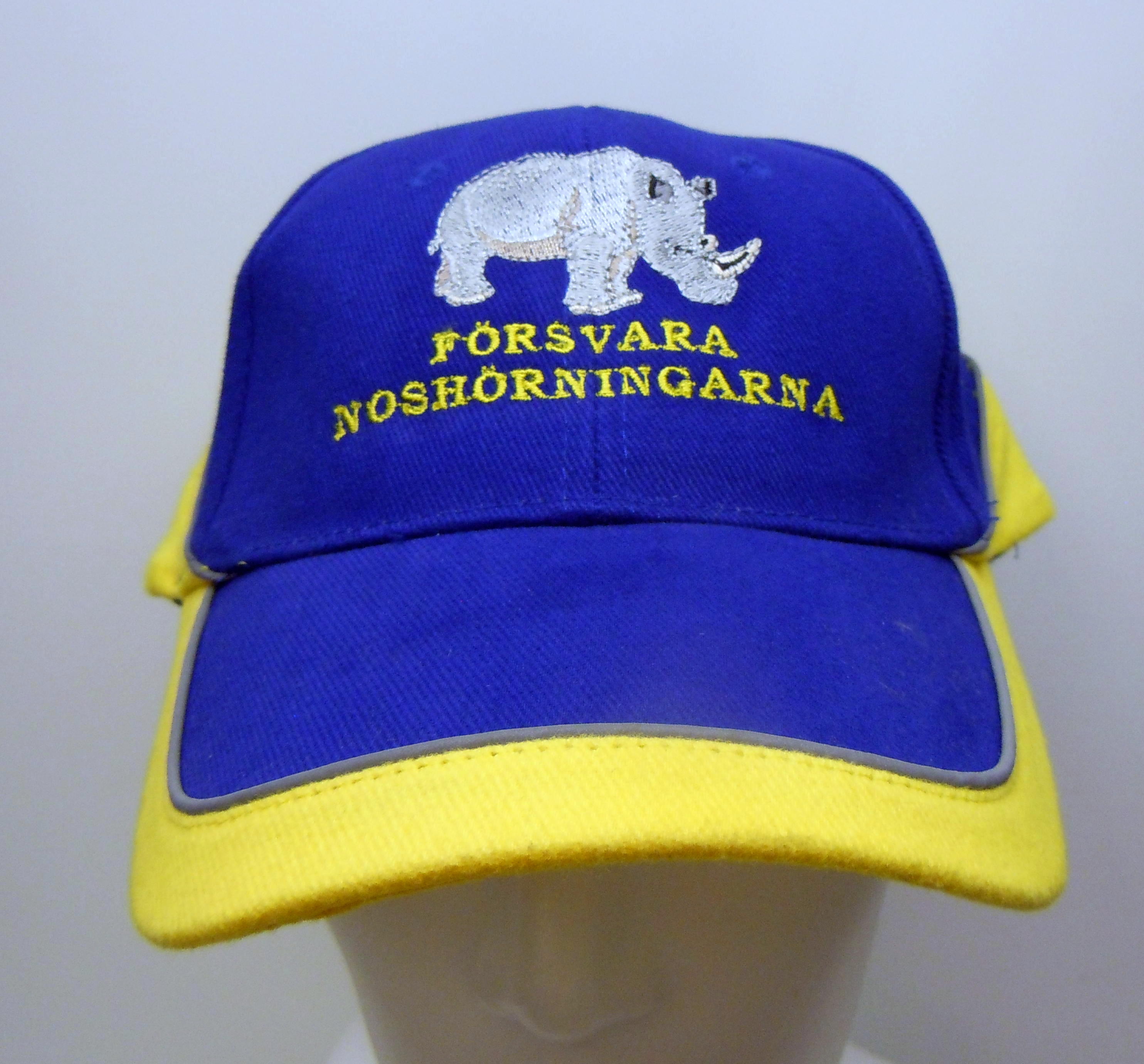 Försvara Noshörningarna Broderad keps, Blå/gul
