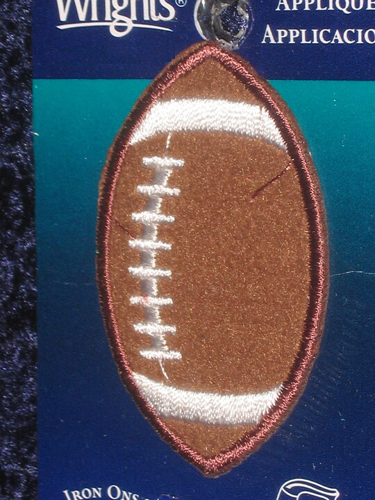 Flerfärgad stryka-på applikation, rugbyboll (35 x 55 mm)