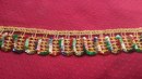 Guldfärgat paljettband 40 mm