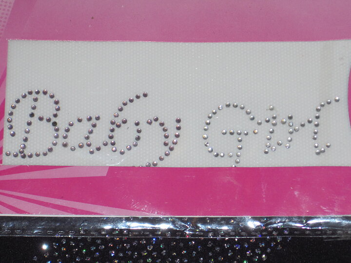 Silverfärgad stryka-på applikation, baby girl (130 x 30 mm)