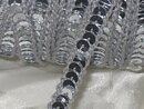 Silverfärgat paljettband 10 mm
