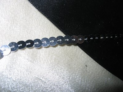 Silverfärgat paljettband 6 mm