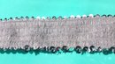 Silverfärgat paljett-stretchband 50 mm