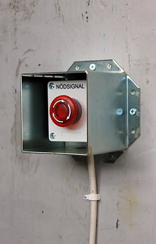 Impact protection for alarm buttons