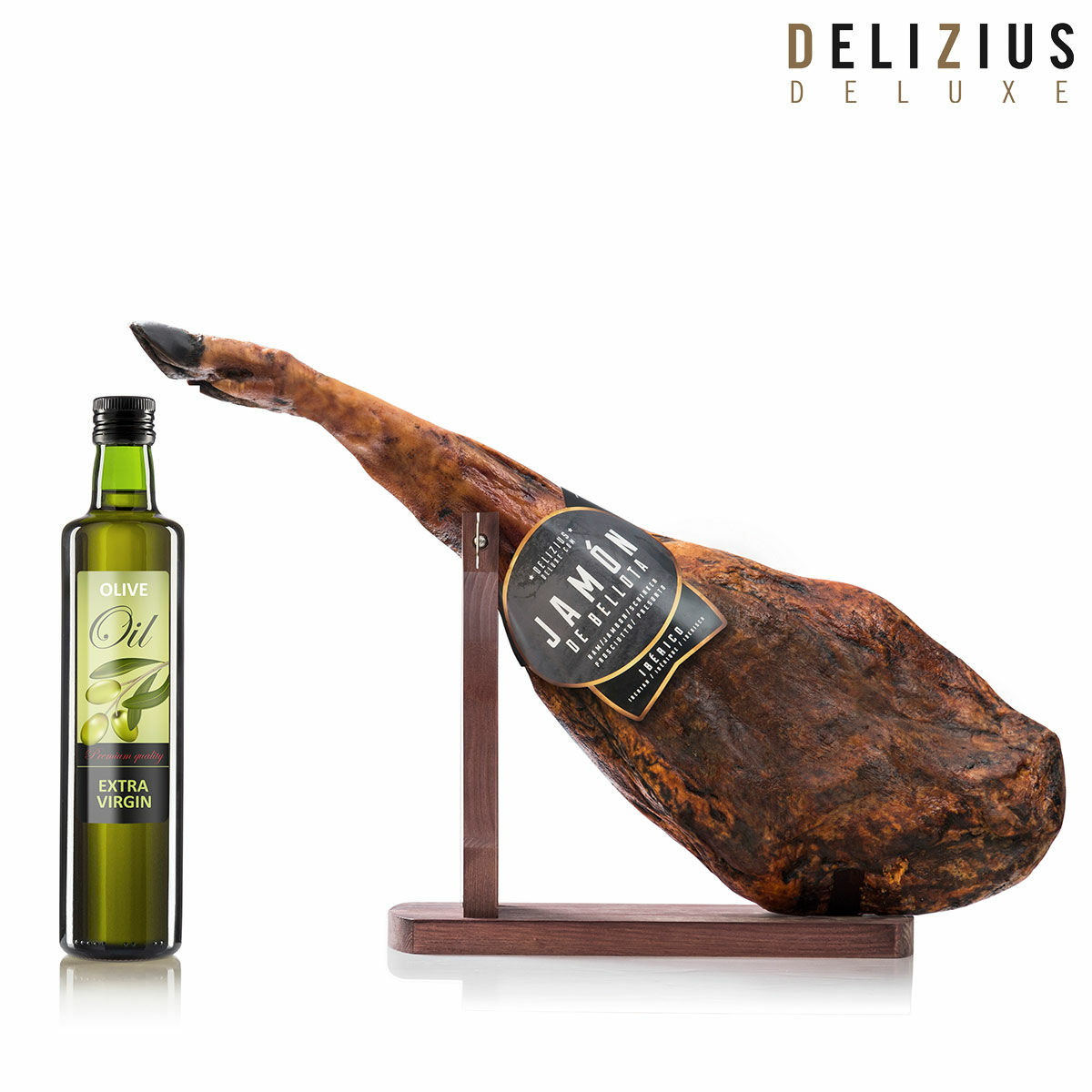 Set som består av iberisk ekollonmatad skinka, olivolja och kötthållare Delizius Deluxe