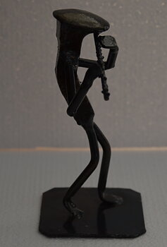 Metallfigur Flöjtist
